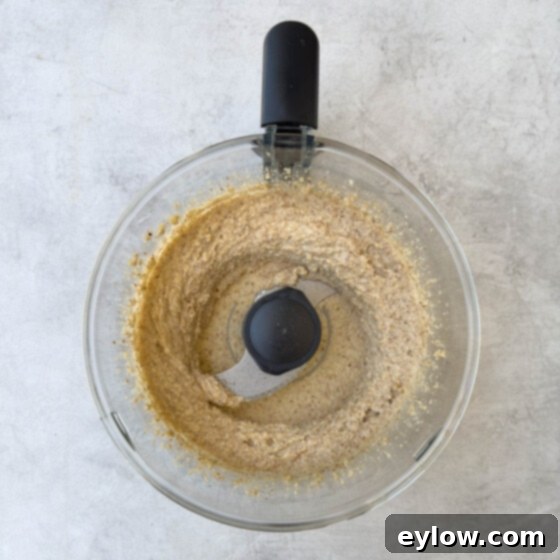 Making the cake batter, ground almonds and lemon in a food processor workbowl.