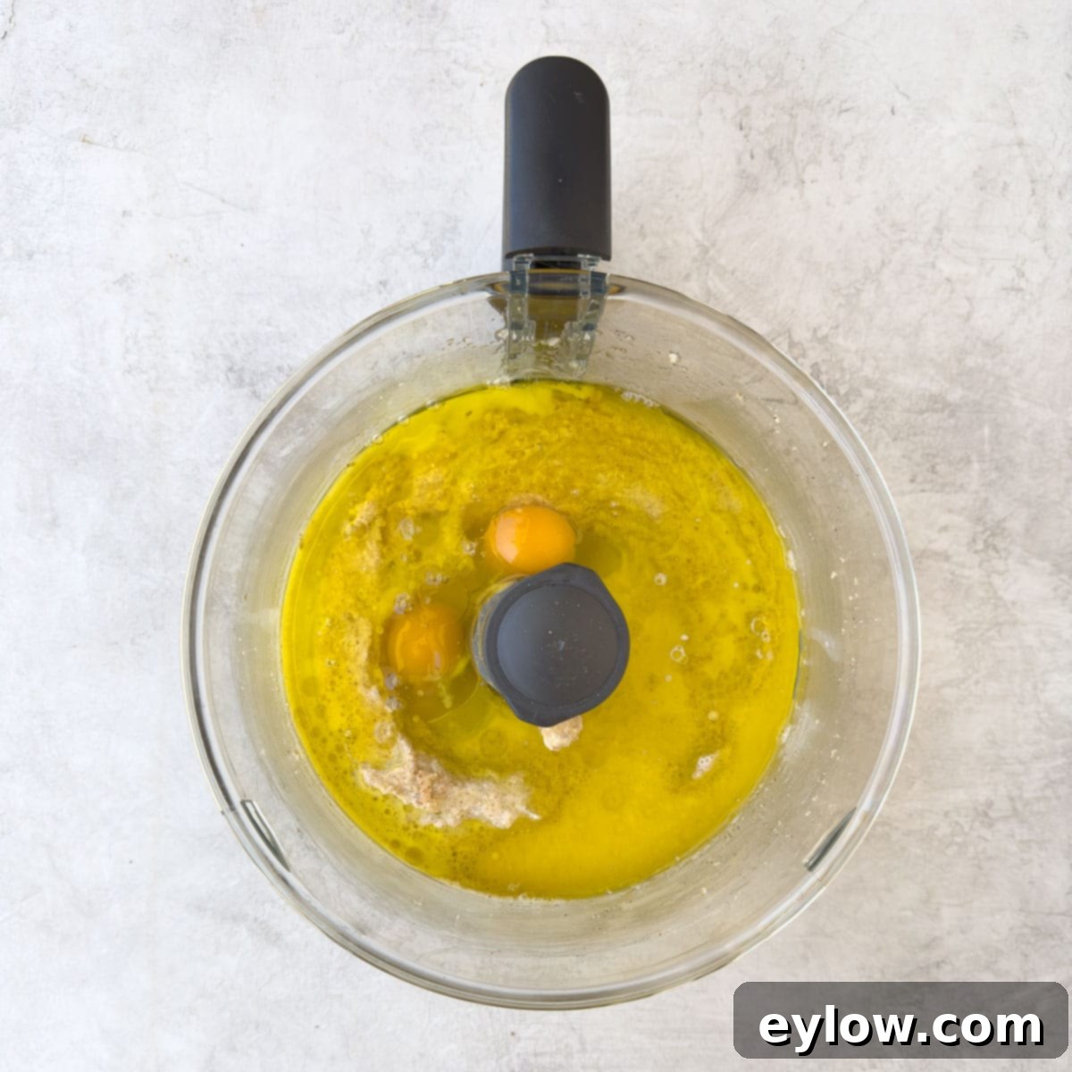 Adding the wet ingredients, eggs and olive oil.  