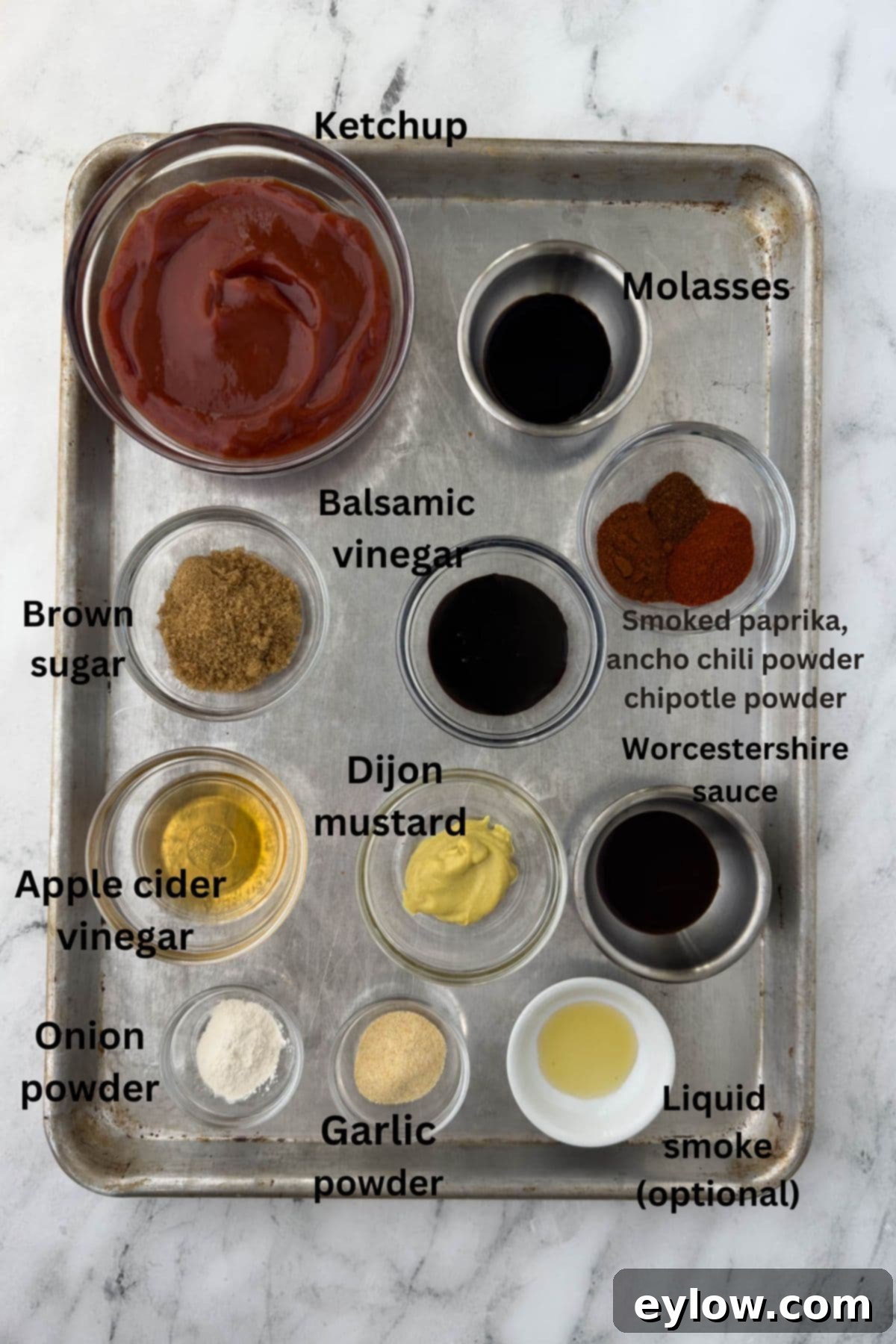 Ingredients for homemade bbq sauce in small bowls on a tray.