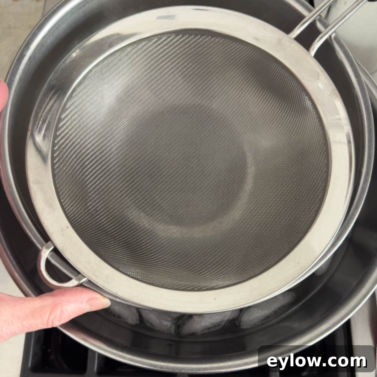 Aromatic Vanilla Bean Bliss 4 Set up an ice bath with a fine strainer on the top.