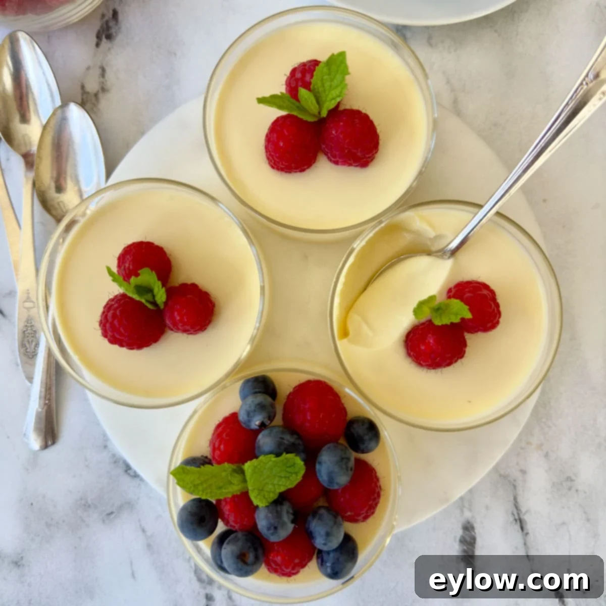 Simply Divine Lemon Posset 8 Four lemon posset custard dessert cups topped with fresh berries.