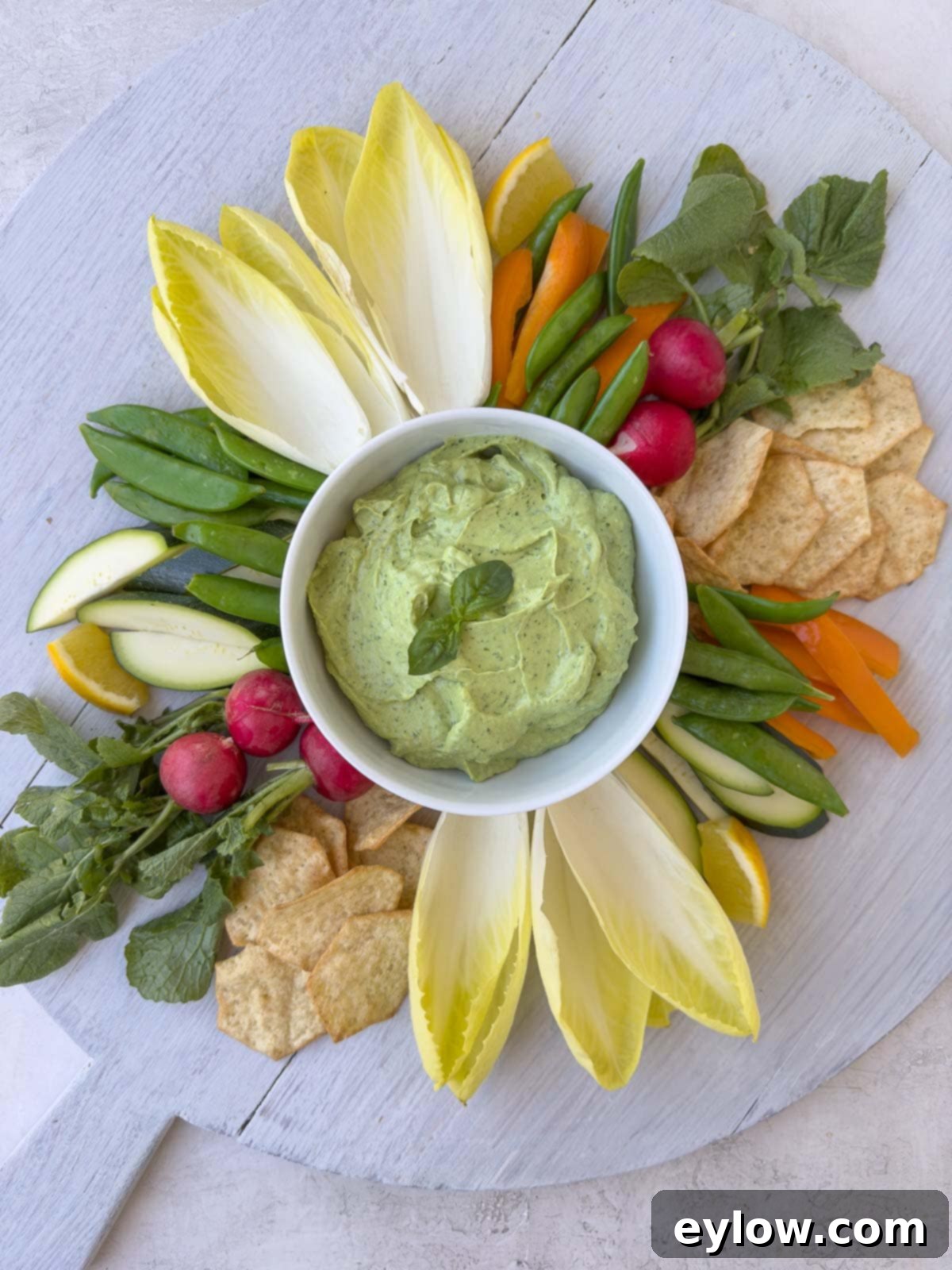 Creamy Avocado Basil Yogurt Dip 2 Veggie and cracker board with creamy avocado basil dip.