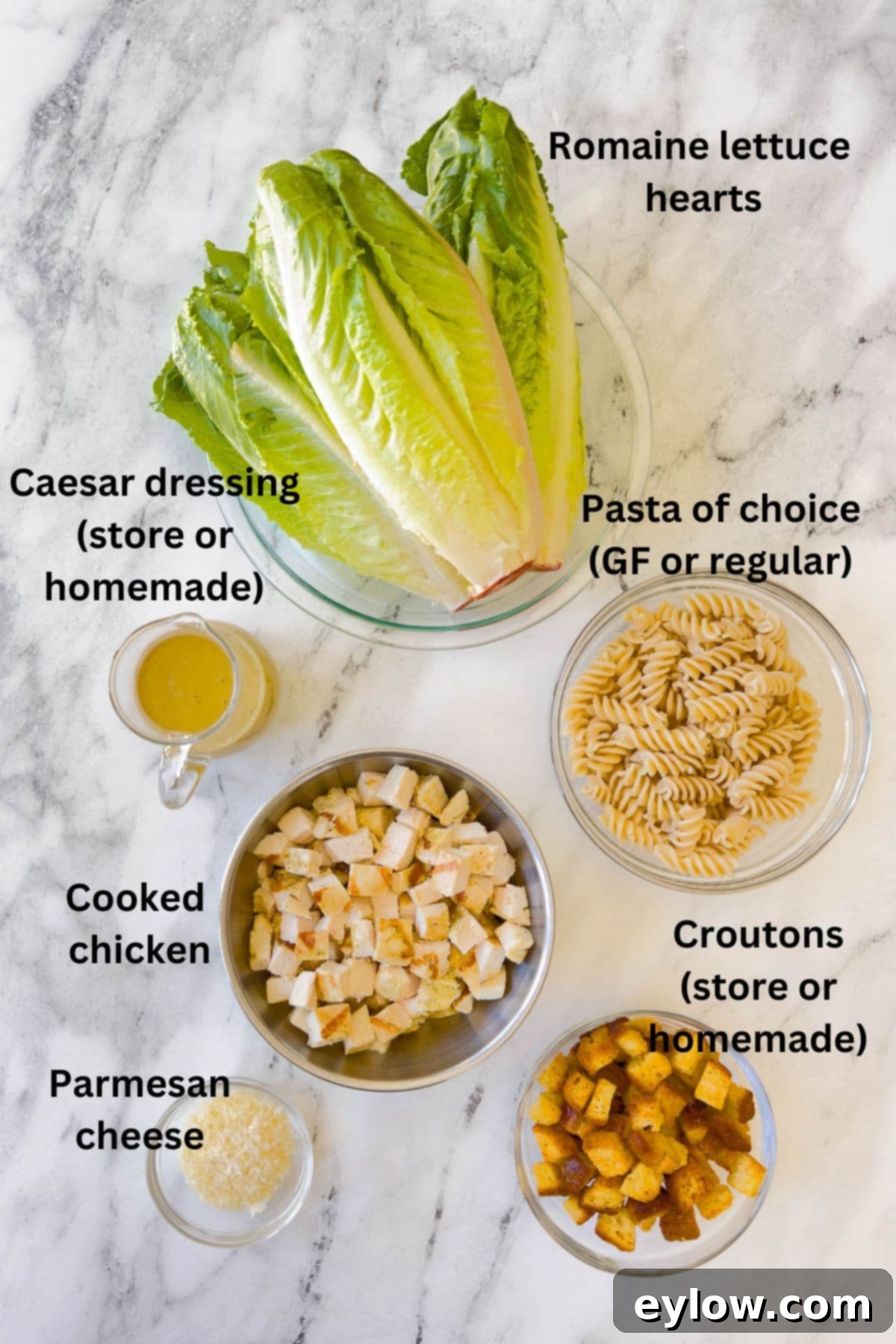 Emperor's Chicken Pasta Salad 3 Ingredients for a Caesar pasta salad with romaine, dressing, pasta, chicken, and croutons plus parmesan.