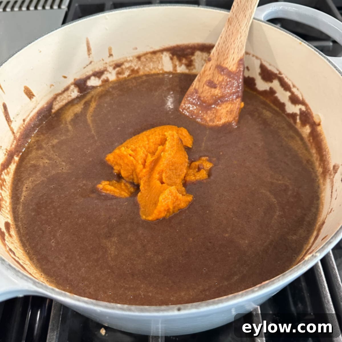 Velvety Black Bean Pumpkin Harvest Soup 7 Adding pumpkin puree to black bean puree for a fall soup.