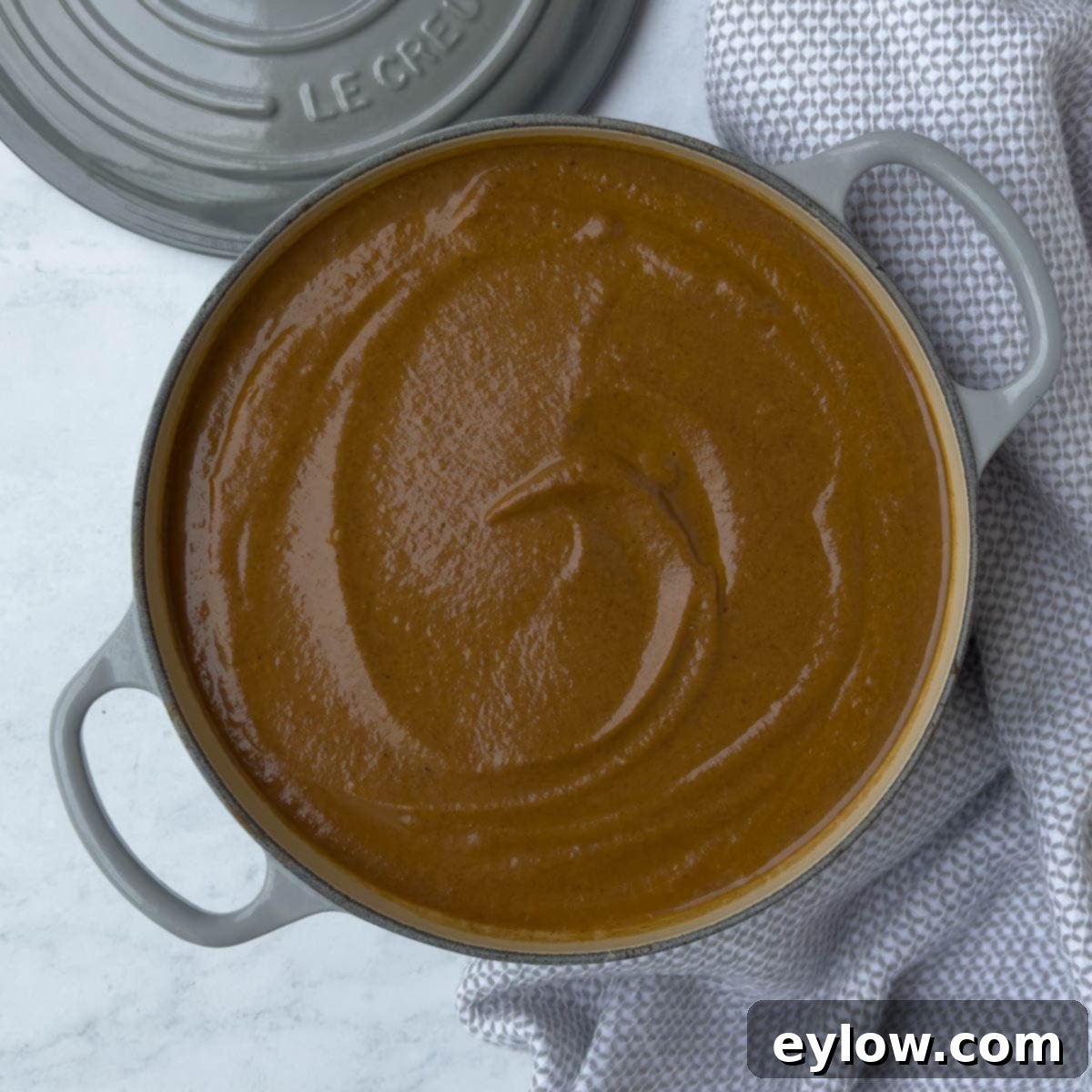 Velvety Black Bean Pumpkin Harvest Soup 8 Creamy pureed black bean soup in a gray Dutch oven.