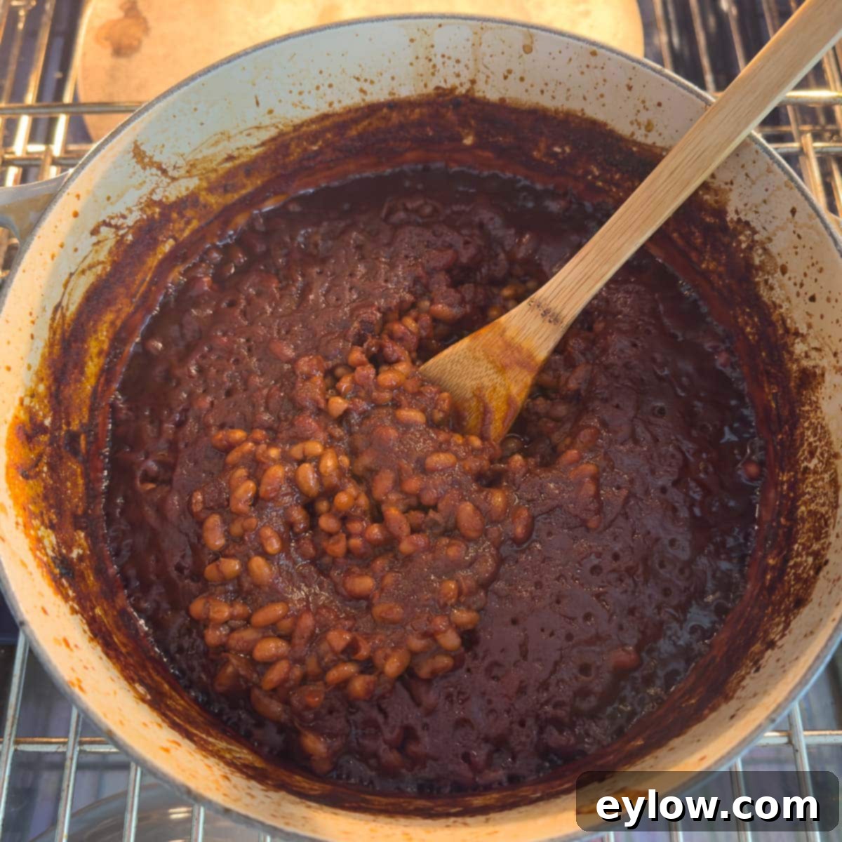 Baked beans after 1 hour in the oven, showing a slightly crusty top and reduced liquid.