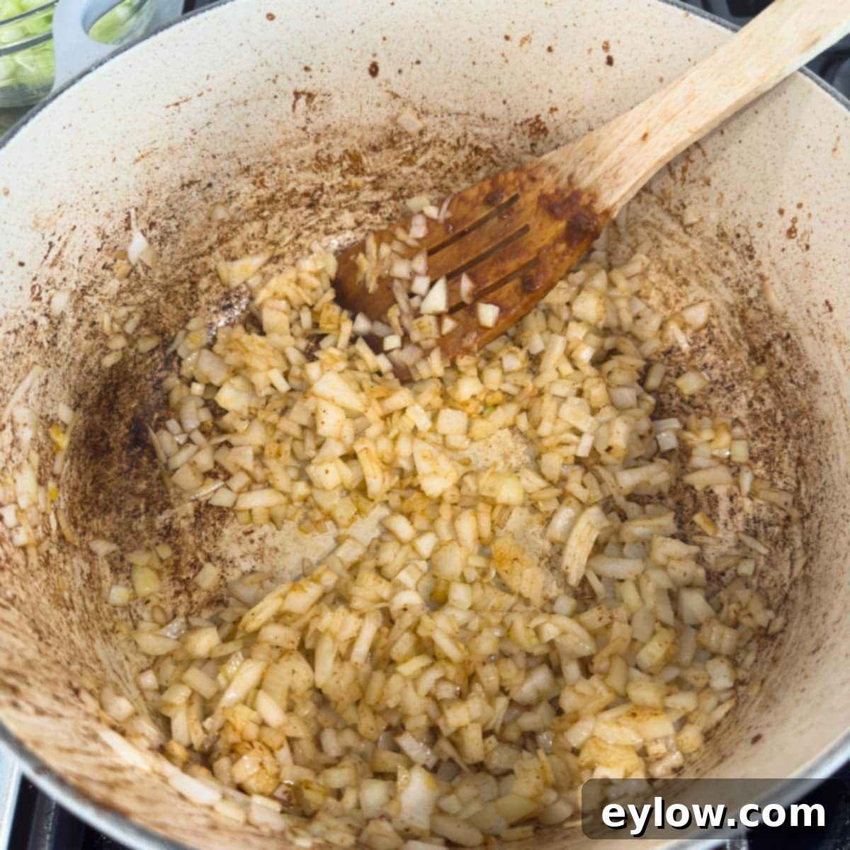 Hearty Beef, Barley & Vegetable Soup 7 Sautéing chopped onions in a Dutch oven until golden and translucent for the soup base.