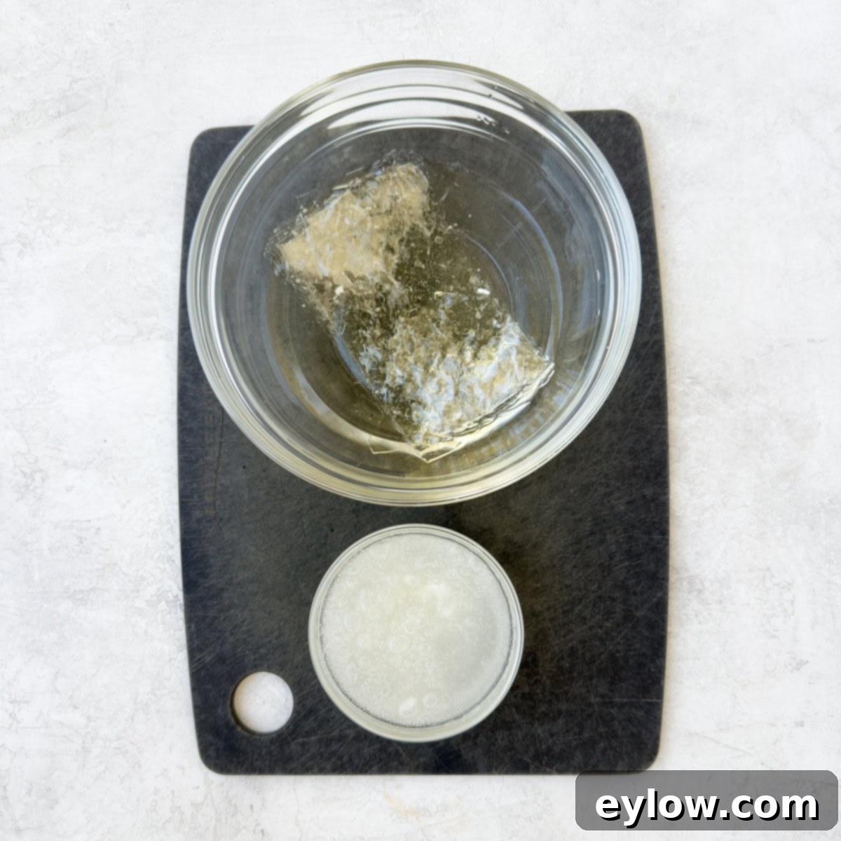 Velvety Strawberry Panna Cotta with Sweet Berry Drizzle 4 Both powdered and leaf gelatin blooming in small bows of water.