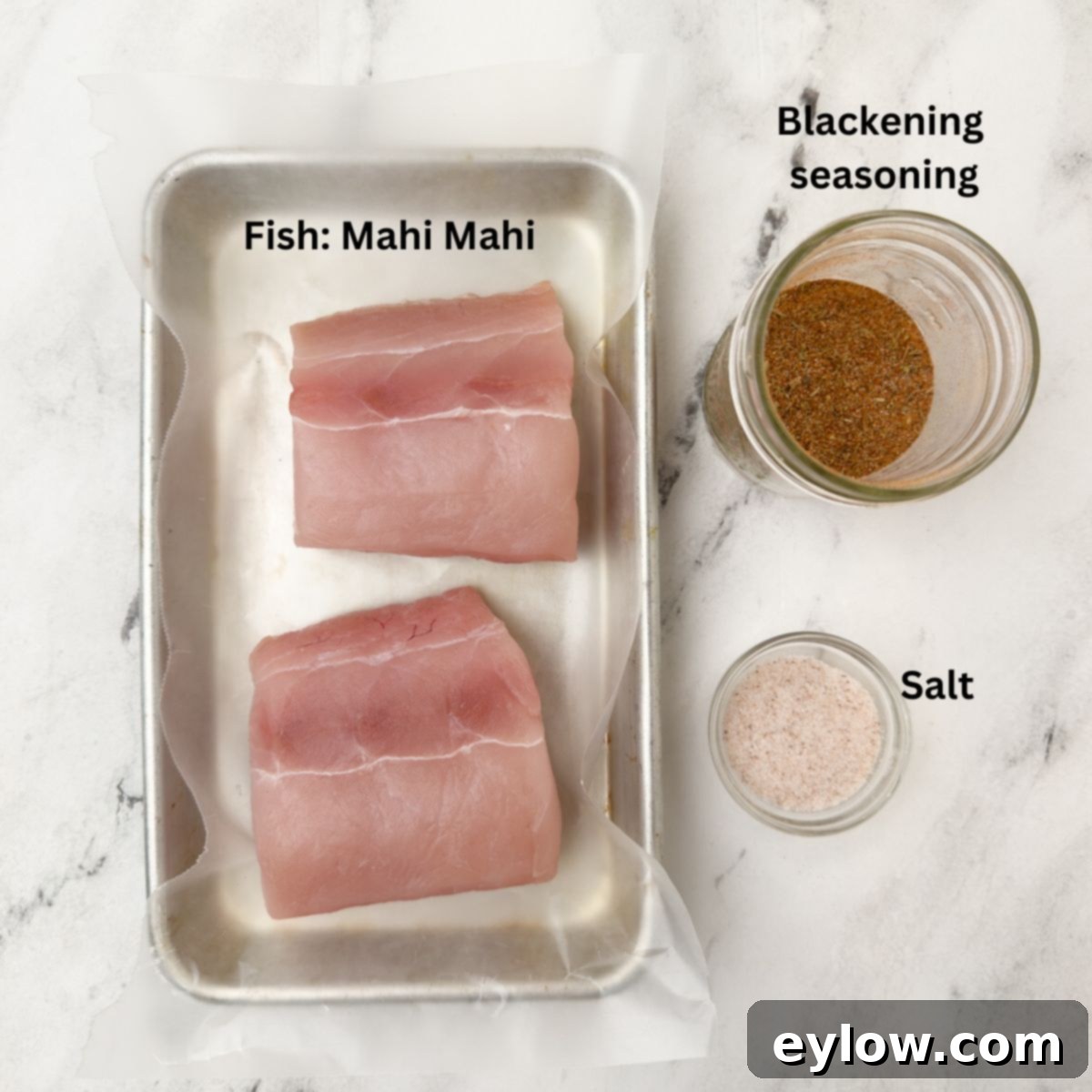 Crispy Blackened Mahi Mahi in the Air Fryer 3 Fresh mahi mahi fillets on a cutting board.