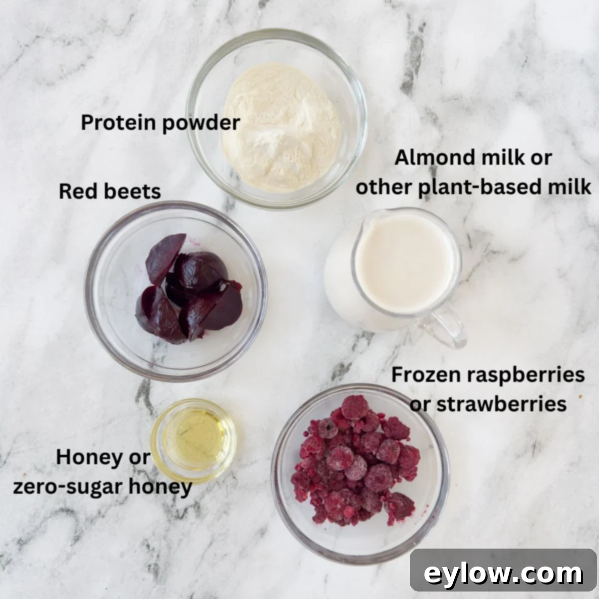 Ingredients for a red beet smoothie on the kitchen counter in prep bowls.