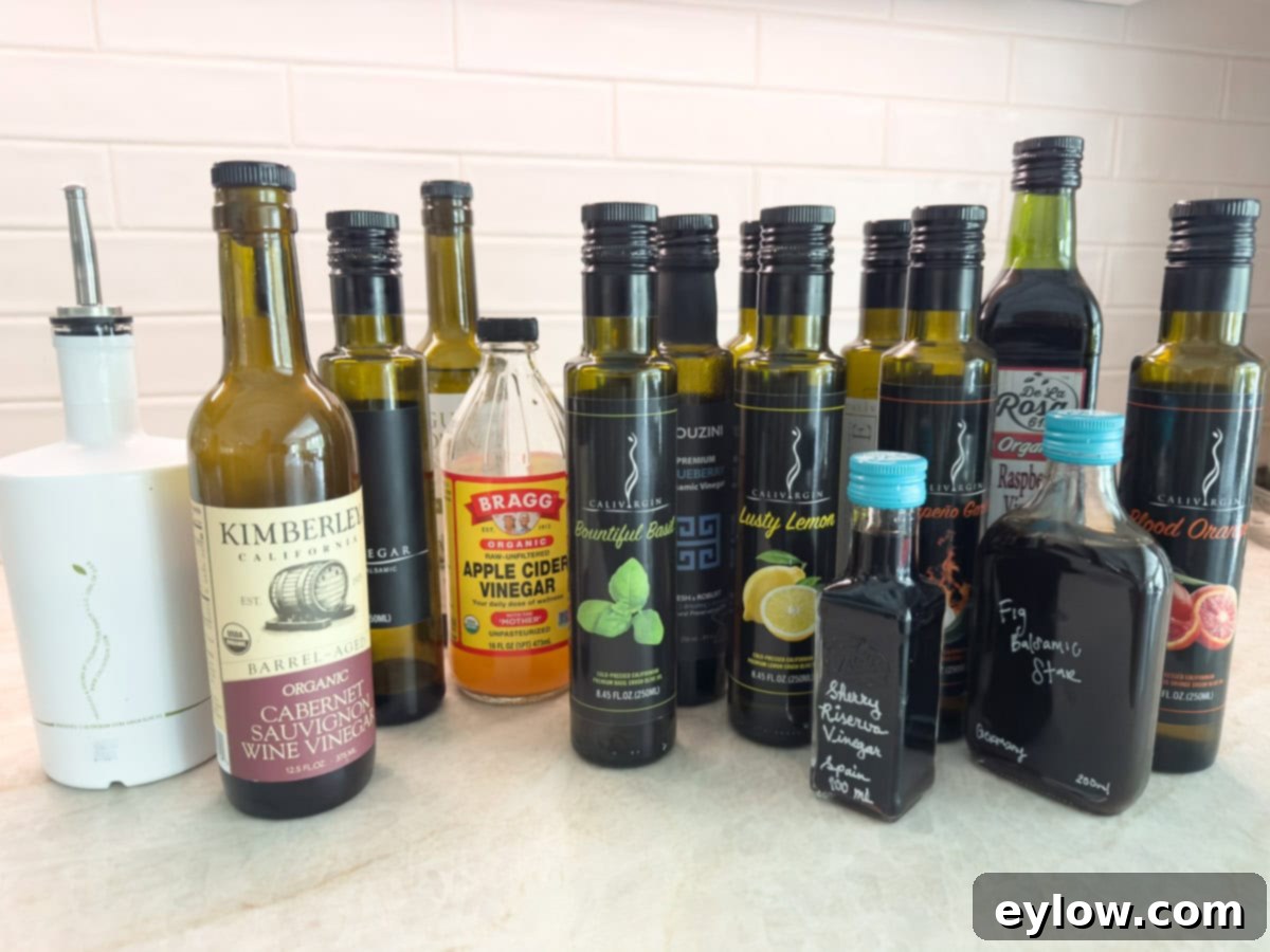 A vibrant collection of various oils and vinegars, artfully arranged in bottles and glasses, ready for crafting diverse vinaigrettes and salad dressings.
