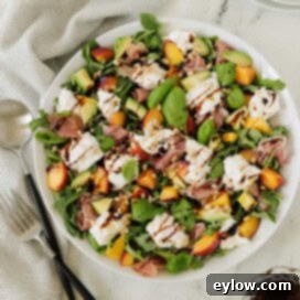 Burrata Peach and Prosciutto Summer Salad 6 Colorful summer salad or burrata cheese, golden peaches, greens, basil, and balsamic dressing.