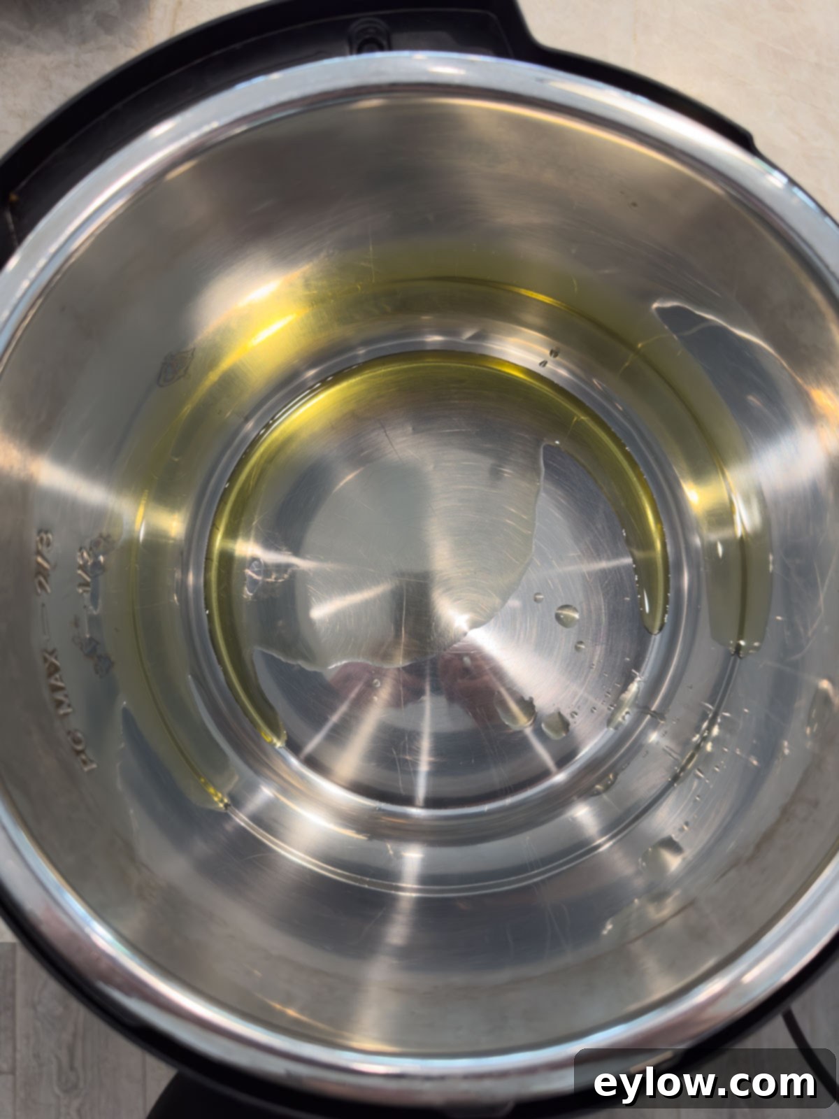 Oil in the bottom of an Instant Pot heating.