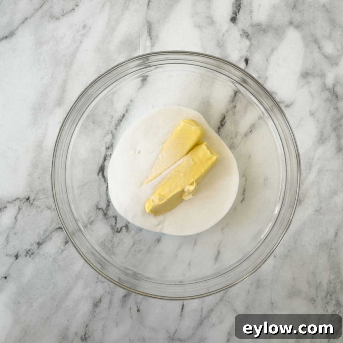 Artisan Gluten-Free Cream Cheese Pound Cake 6 Sugar and butter in a glass bowl ready for creaming step.