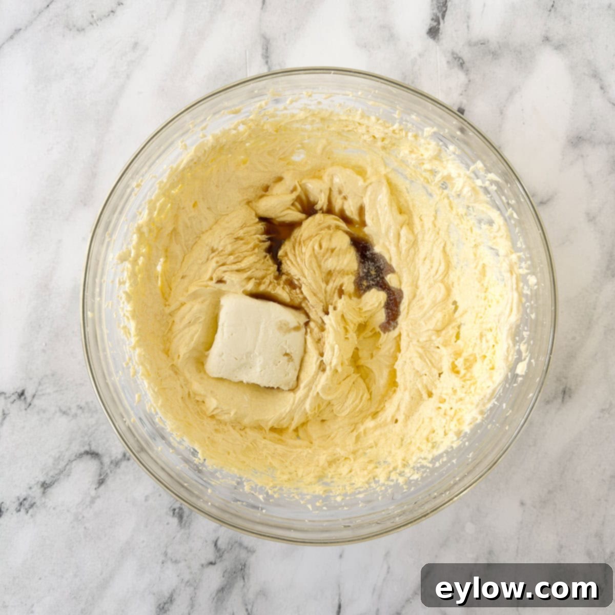 Artisan Gluten-Free Cream Cheese Pound Cake 8 Adding cream cheese and vanilla to the creamed butter and sugar with eggs.