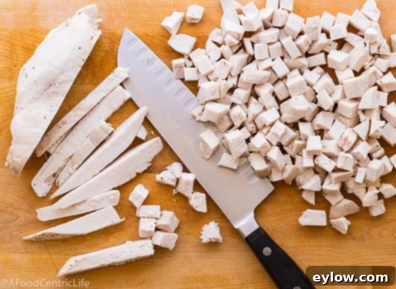 Finely diced poached chicken breast for curried chicken salad.