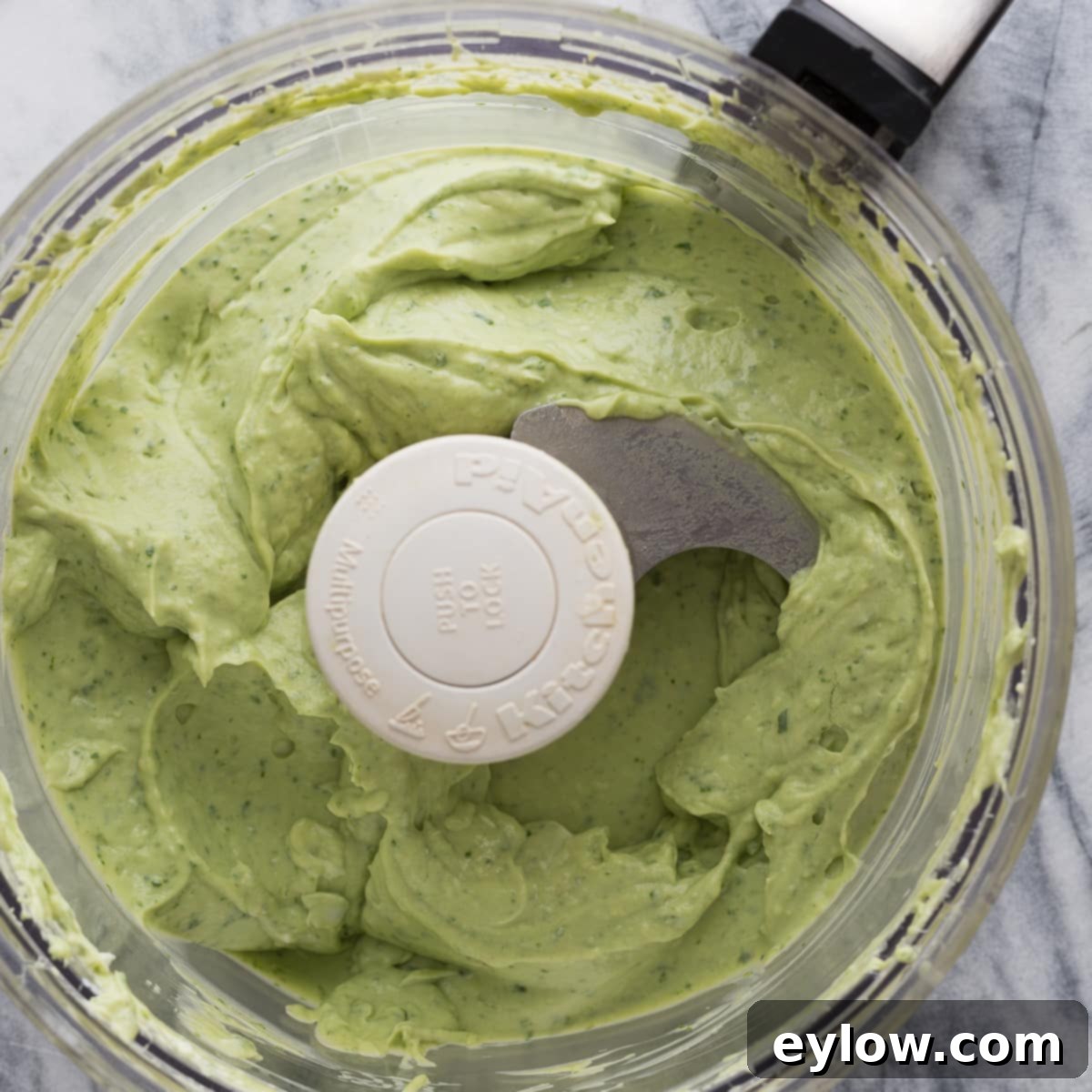 Creamy Avocado Turkey Wraps 3 Green and creamy avocado basil dip in food processor.