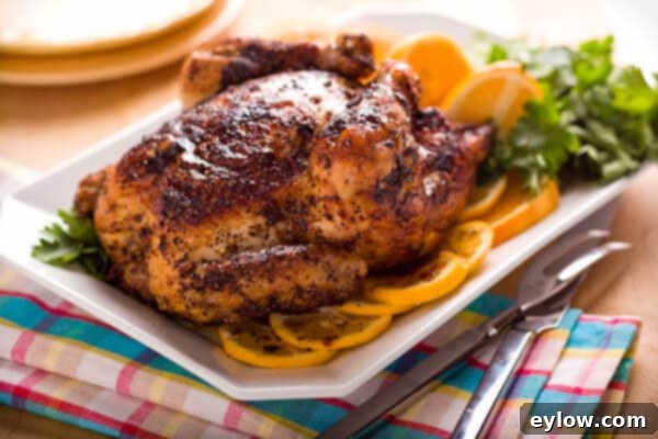 A beautifully roasted whole chicken, presented on an elegant platter with fresh herbs, ready to be served at the dining table.