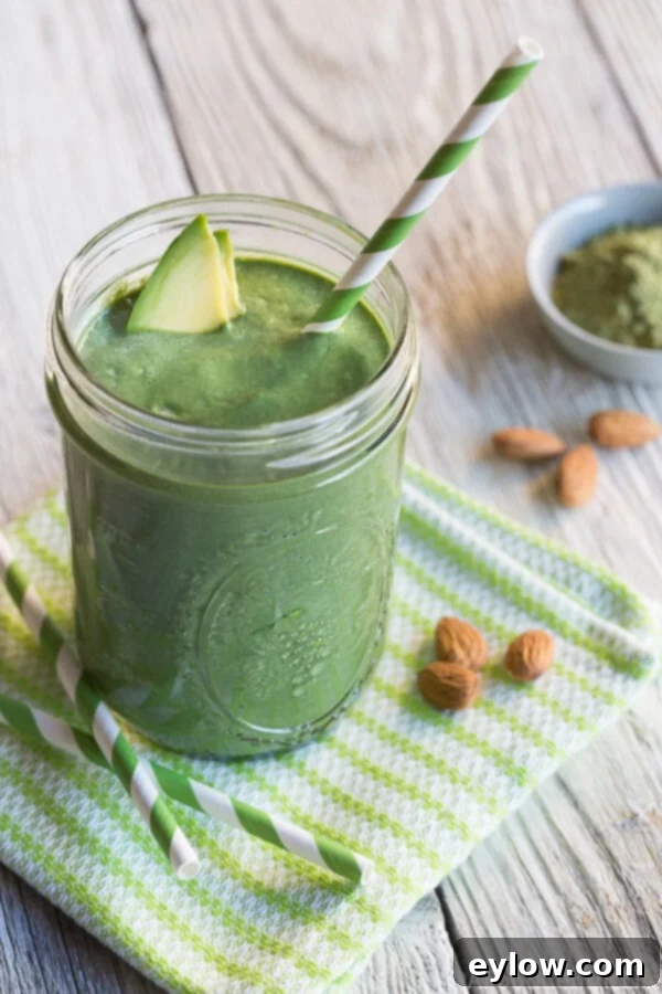 Avocado Matcha Dream Smoothie 5 Matcha avocado smoothie in a glass with a straw