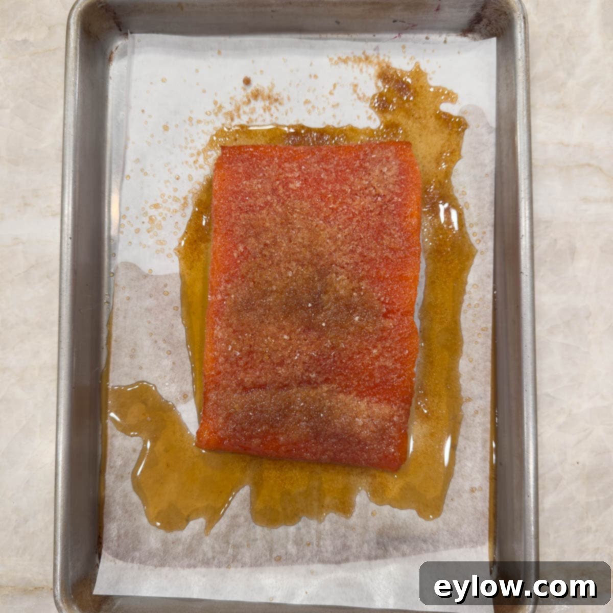 Pellet Grill Smoked Salmon Perfection 7 Salmon fillet after curing with sugar and salt with excess liquid on tray.