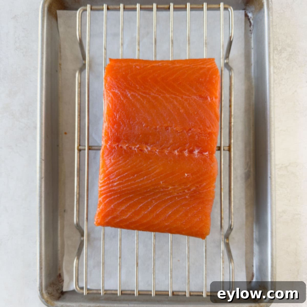 Pellet Grill Smoked Salmon Perfection 10 Salmon fillet on a wire rack after drying and formation of the pellicle.
