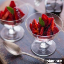 Homemade Balsamic Glazed Strawberries 8 Strawberries with Balsamic syrup in stemmed glasses for dessert.