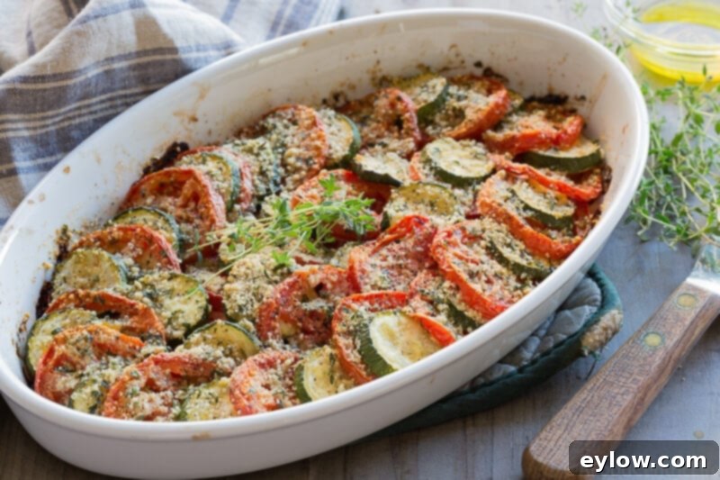 Zucchini Tomato Harvest Bake 2 Freshly baked zucchini tomato casserole with a golden, crispy topping. A perfect summer side dish.