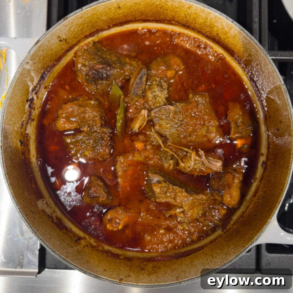Rich Braised Beef Short Rib Ragu 12 A pot of beef short ribs finished braising in wine and broth.