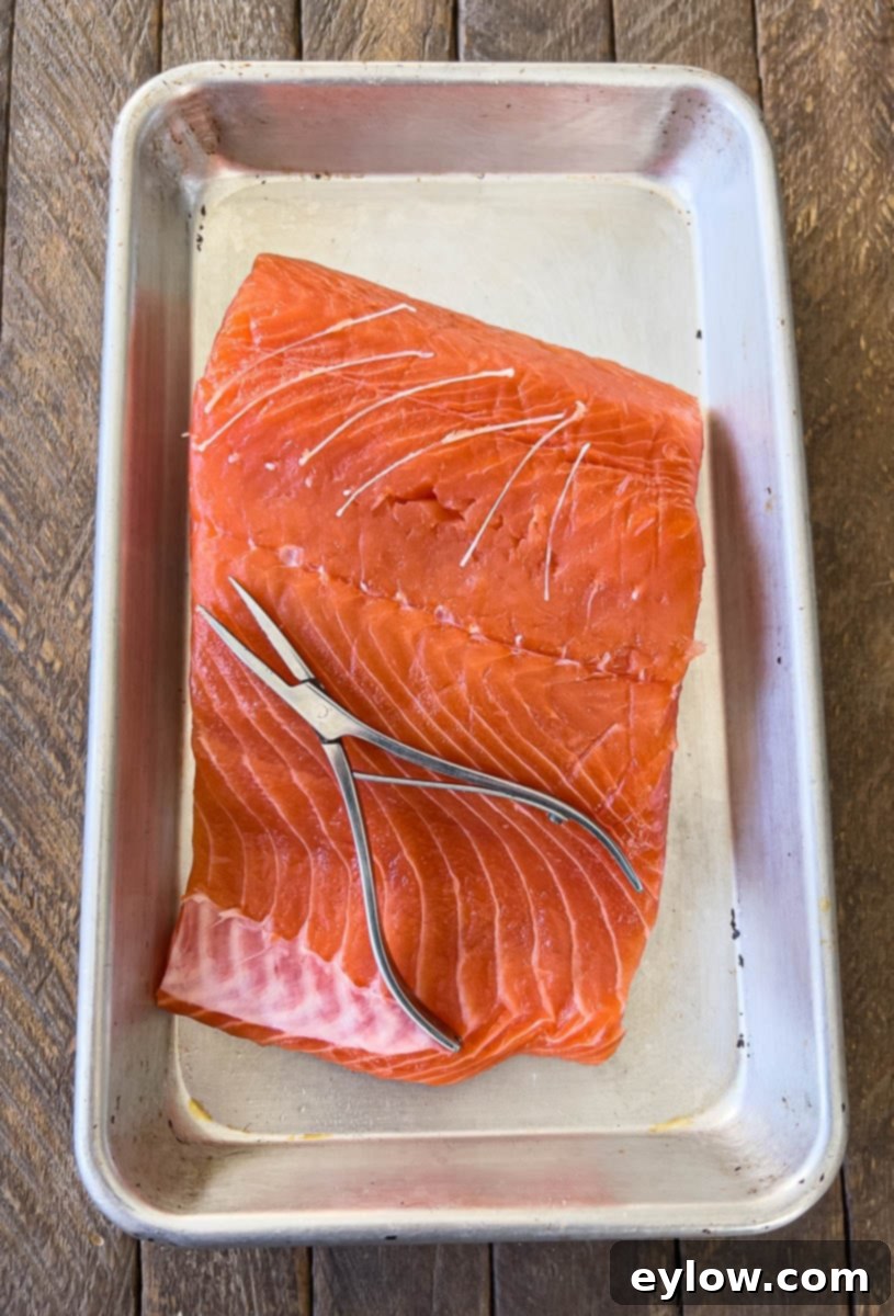 Effortless Skillet Salmon 4 Removing pin bones from salmon filets.