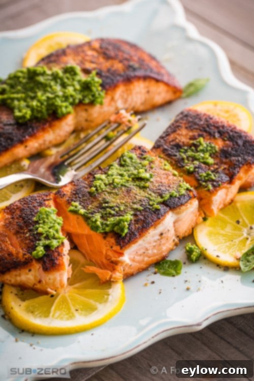 Effortless Skillet Salmon 5 Bright orange salmon on a dinner plate.