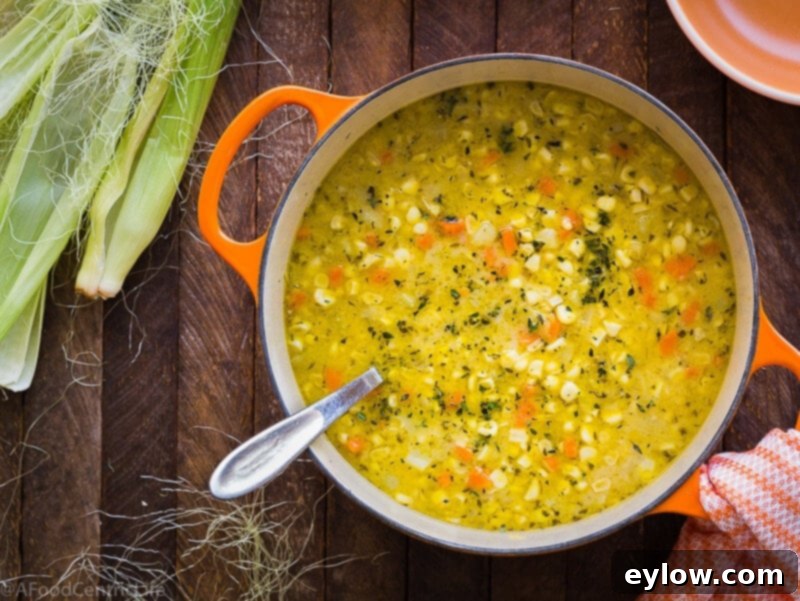 Creamy Dairy-Free Potato Corn Chowder 3 A close-up of a bowl of creamy corn chowder, showcasing its rich texture and golden color.