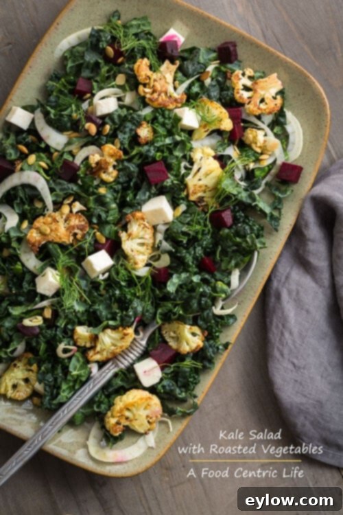 Vibrant Roasted Vegetable and Kale Bowl 2 colorful kale salad on a platter with roasted beets and cauliflower.