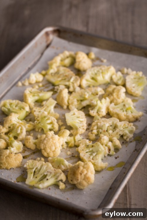 Vibrant Roasted Vegetable and Kale Bowl 4 Sliced cauliflower ready to roast on a baking sheet.