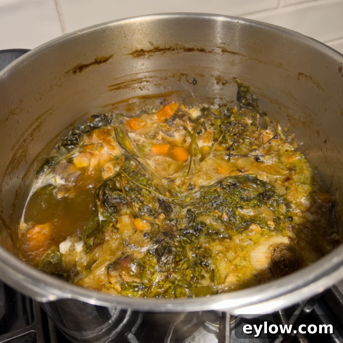 Homemade Turkey Stock 6 Rich turkey broth simmering gently on the stovetop.