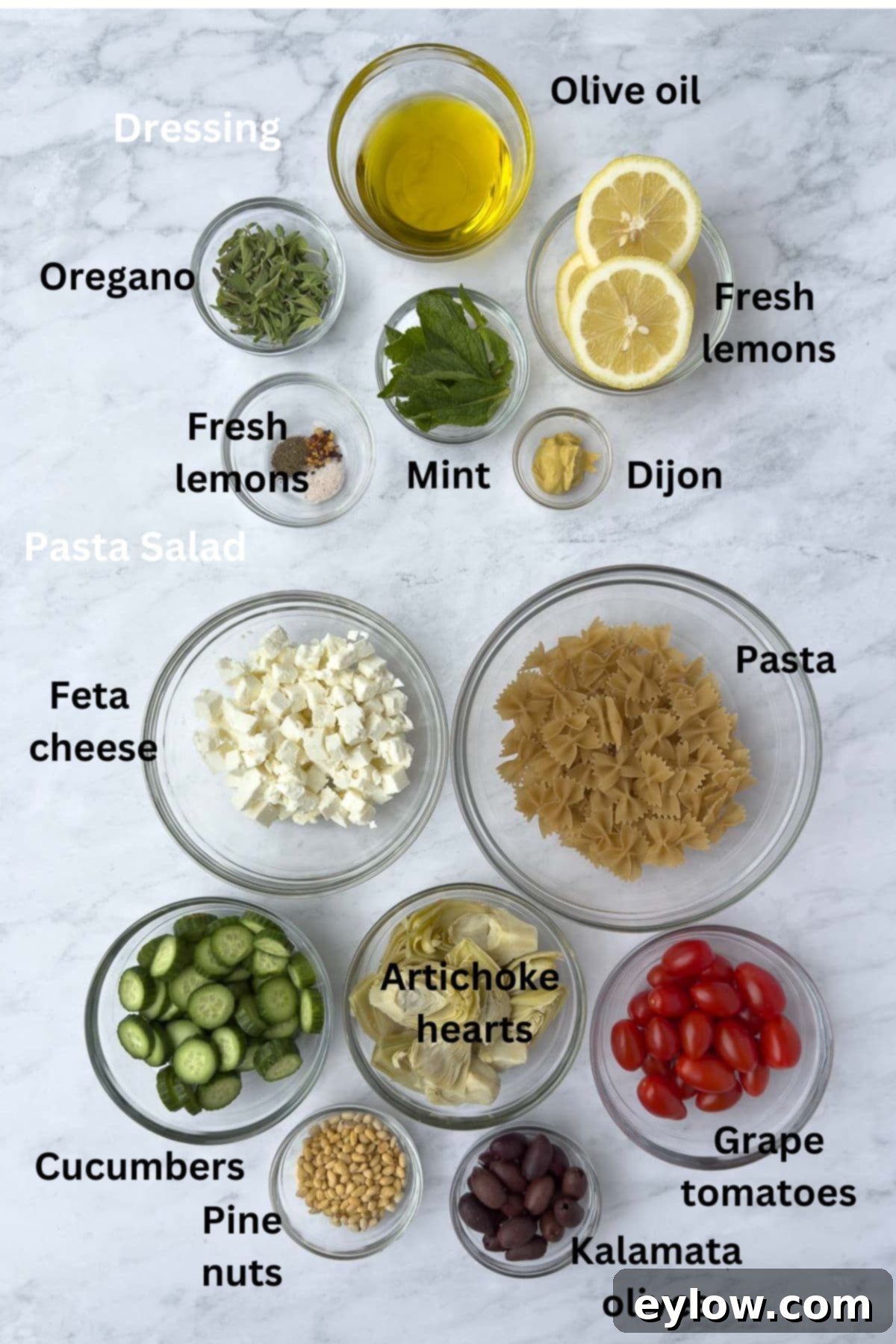 Dressing and salad ingredients for Mediterranean pasta salad. 