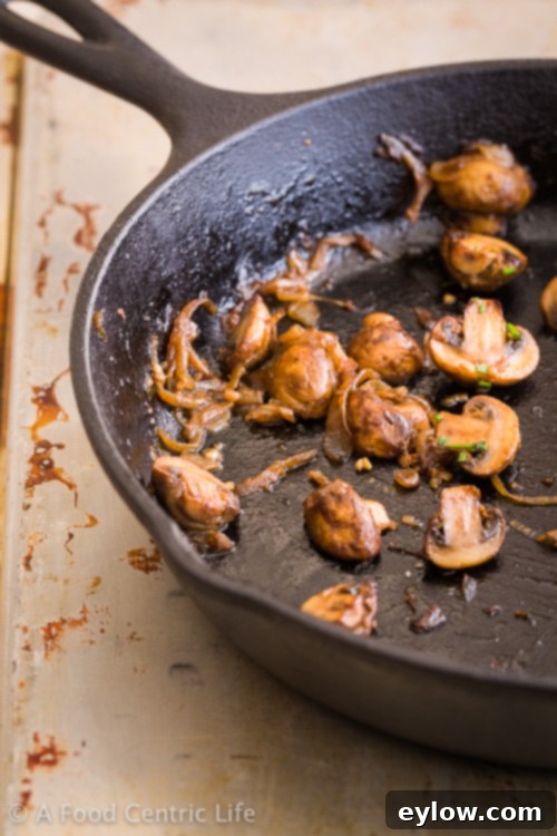 A generous serving of steakhouse roasted mushrooms in a bowl, ready to be enjoyed as a side or main dish.