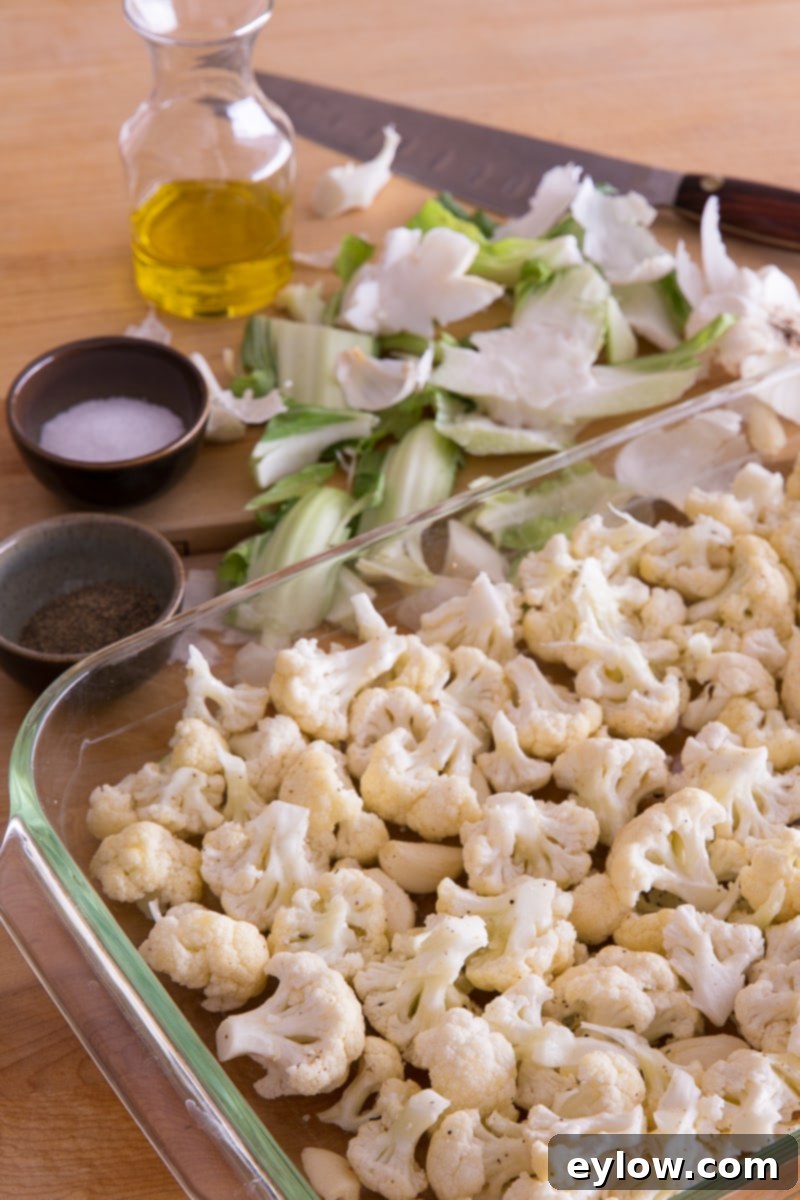 Cauliflower florets in a casserole for roasting.