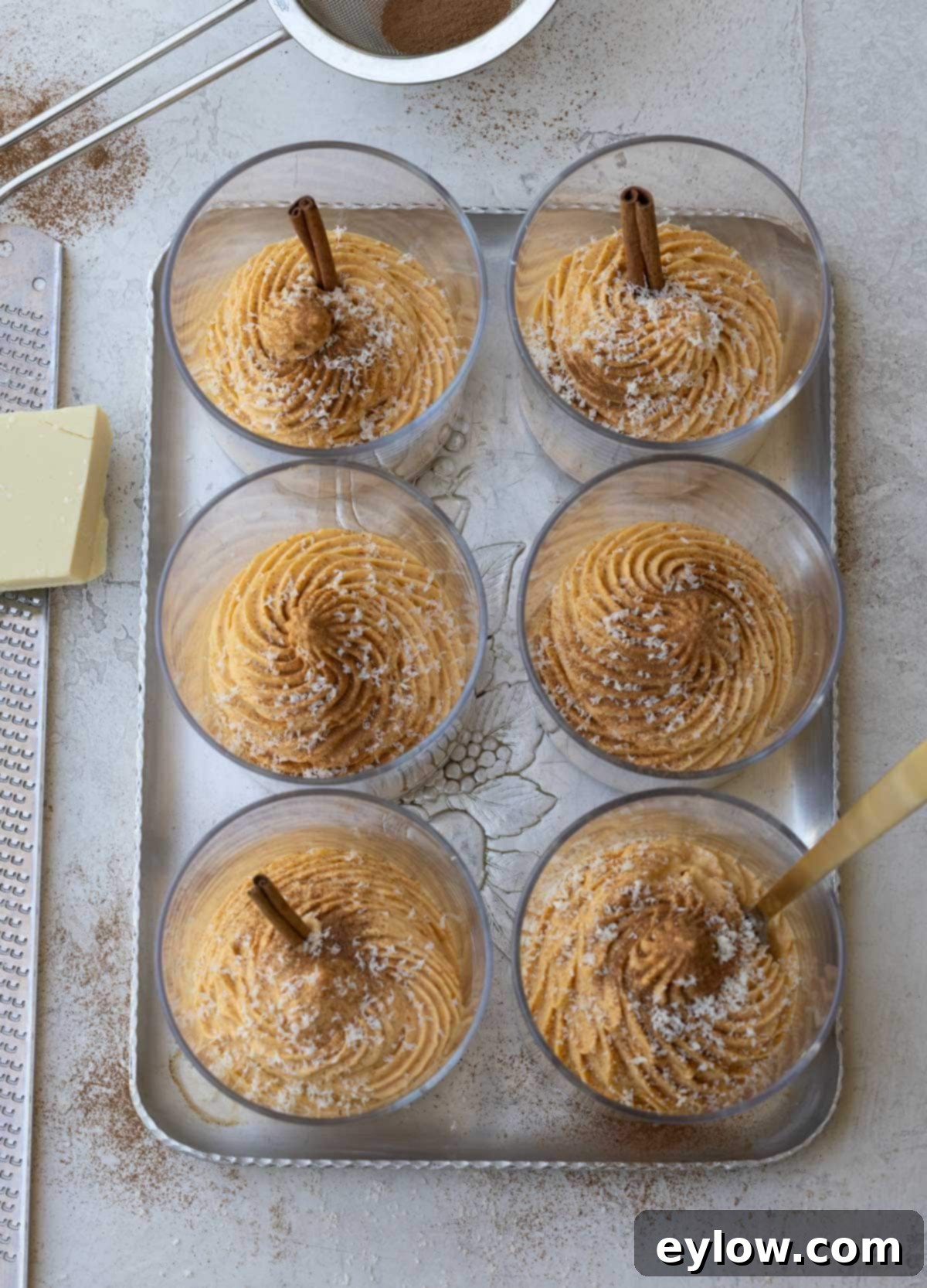 Velvet Pumpkin Mousse No-Bake Treat 13 A tray of 6 pumpkin mousse desserts, elegantly piped and garnished, ready to serve.