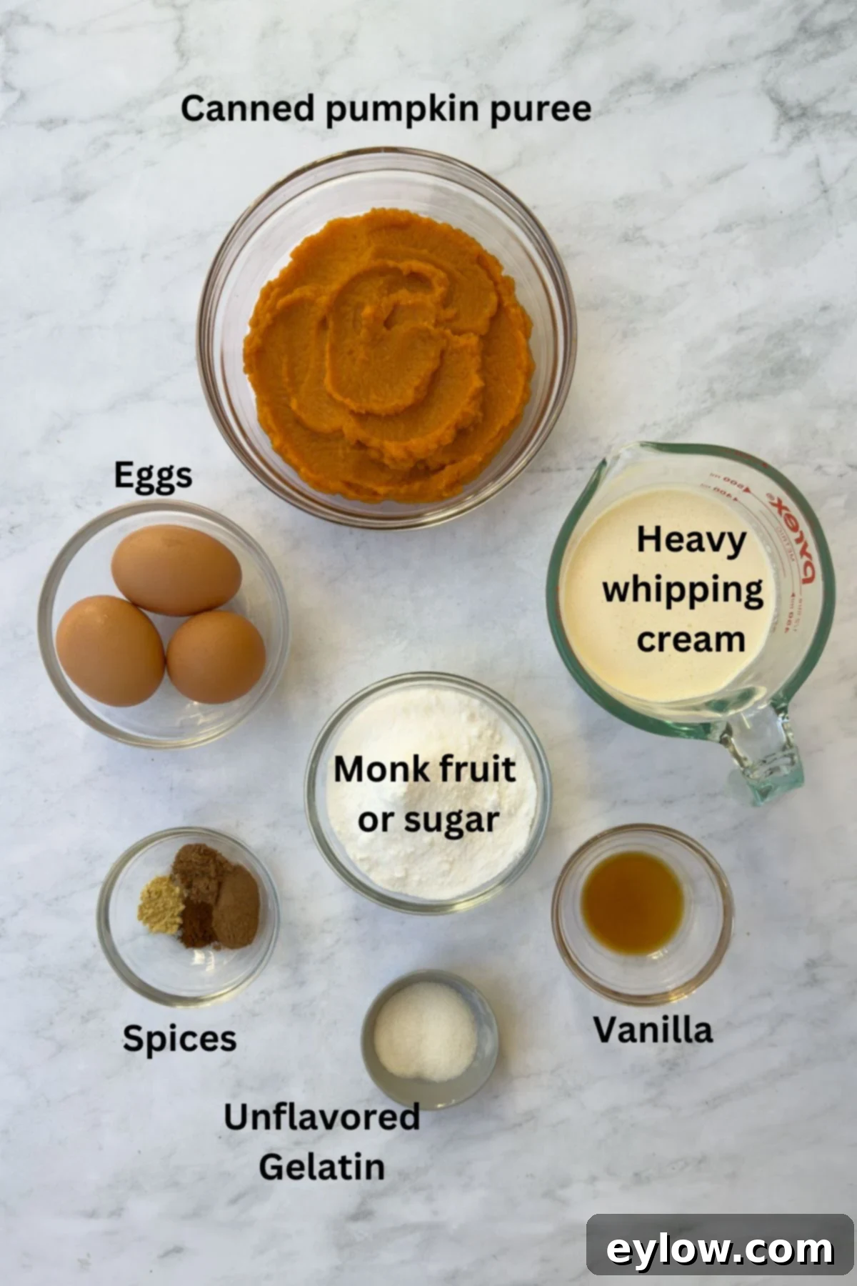 Velvet Pumpkin Mousse No-Bake Treat 3 Ingredients for pumpkin mousse in glass bowls, including pumpkin puree, spices, sugar, and cream.