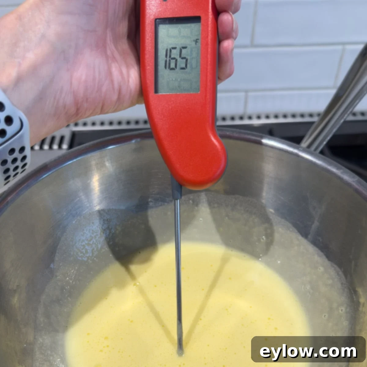 Velvet Pumpkin Mousse No-Bake Treat 7 Cooking egg yolks with sugar to 165°F on stovetop using a double boiler method.