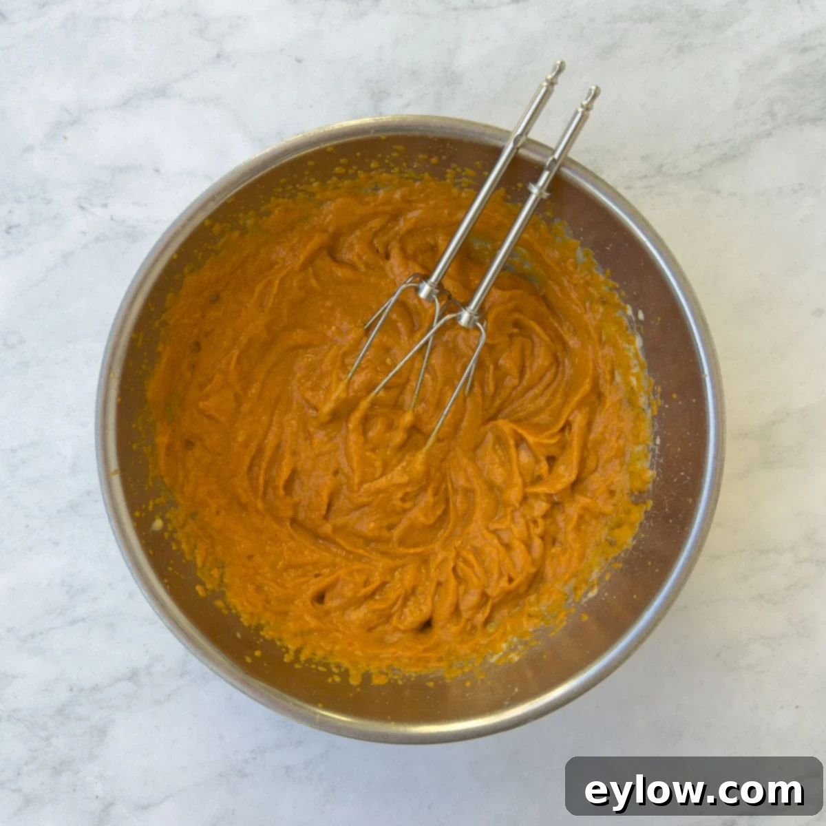 Velvet Pumpkin Mousse No-Bake Treat 9 Beating canned pumpkin into the cooled egg yolks and sugar mixture.