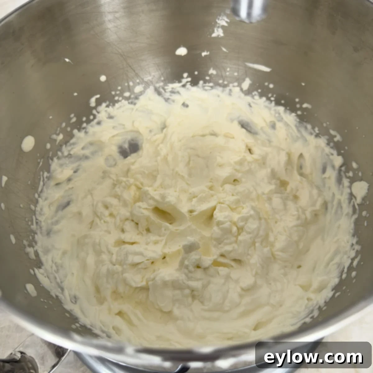 Velvet Pumpkin Mousse No-Bake Treat 10 Whipping heavy cream in the bowl of a mixer until stiff peaks form.