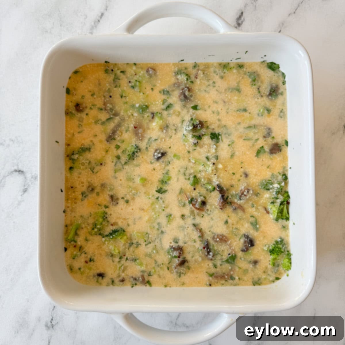 Gluten free breakfast casserole ready to bake in the oven.