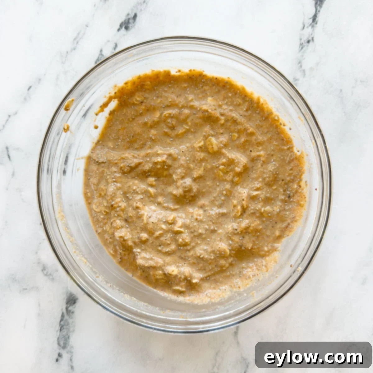 Mixed base of pumpkin overnight oats in a bowl, ready to be portioned and chilled.